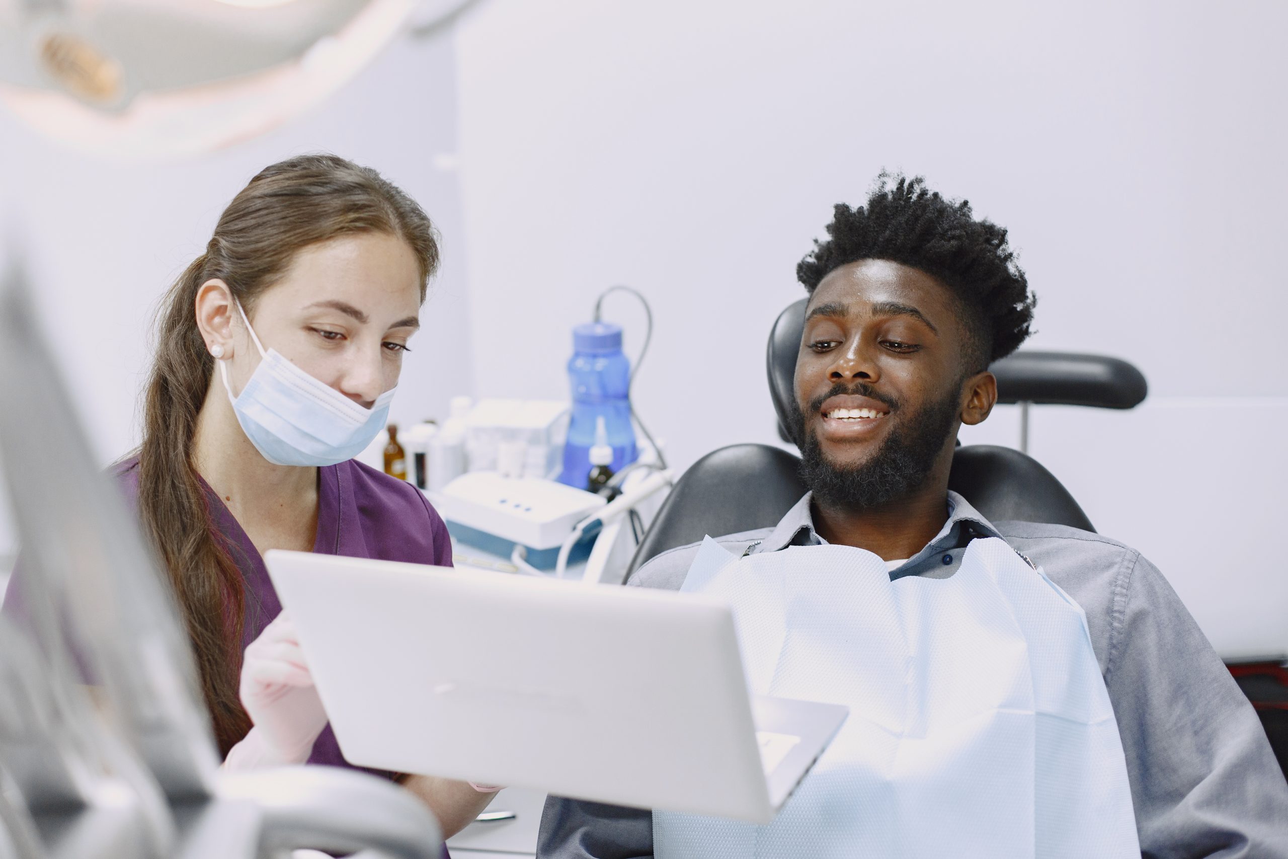 African patient in dentistry sitting in dental chair