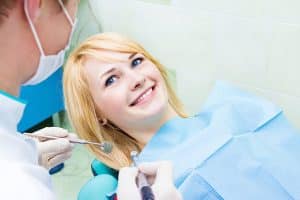Finding a new dentist can be difficult and expensive. You have to find the right one for your needs. Contact Lee Family Dentistry for general dentistry treatments. Image of smiling woman patient getting a dental prodedure.